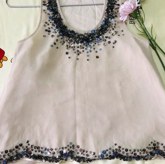 Tops - Creme sleeveless Top with shining work